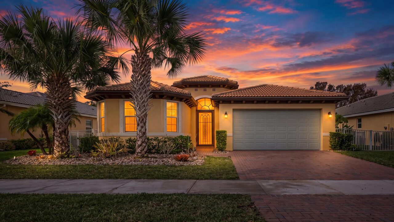 Newer-construction Port St. Lucie home with tile roof and fresh stucco paint at sunset